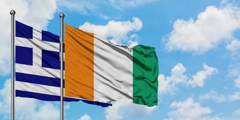 Greece and Cote D'Ivoire flag waving in the wind against white cloudy blue sky together. Diplomacy concept, international relations.