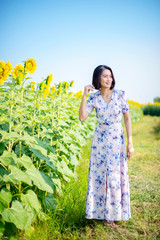 young woman in field of flowers