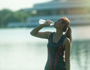 women are exercise in the morning in the garden the backdrop is a bird and a pond for healthy...