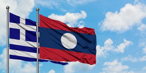 Greece and Laos flag waving in the wind against white cloudy blue sky together. Diplomacy concept,...