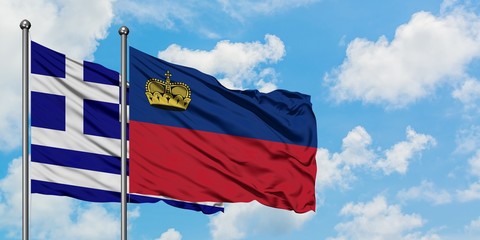 Greece and Liechtenstein flag waving in the wind against white cloudy blue sky together. Diplomacy...