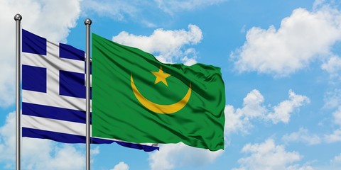 Greece and Mauritania flag waving in the wind against white cloudy blue sky together. Diplomacy concept, international relations.
