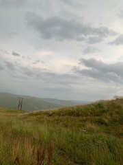 Fototapeta na wymiar mountain landscape with fluffy clouds