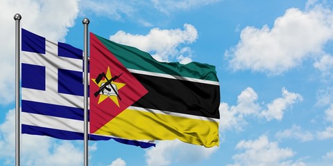Greece and Mozambique flag waving in the wind against white cloudy blue sky together. Diplomacy concept, international relations.