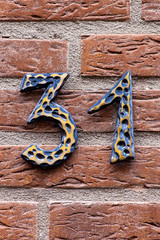 antique number 31 on brick wall