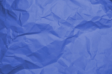 Blue crumpled paper texture background.