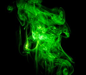 Obraz premium Green smoke on black background