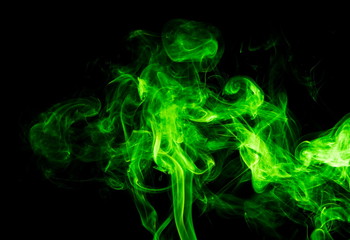 Fototapeta premium Green smoke on black background