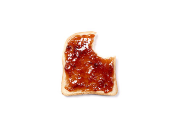 bitten slice of toasted bread with strawberry jam  with copy space for your text