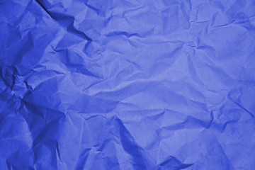 Fototapeta premium Blue crumpled paper texture background.
