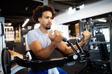 Fitness, sport, exercising and lifestyle concep Young man working out in gym