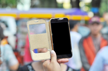 Close up Hand hold mobile phone with broken glass screen display