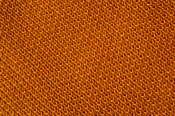 Close-up of an orange knitted fabric