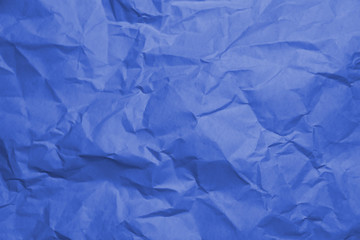 Blue crumpled paper texture background.