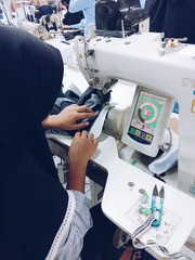 the process of making clothes by a sewing operator