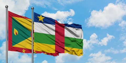 Grenada and Central African Republic flag waving in the wind against white cloudy blue sky together. Diplomacy concept, international relations.
