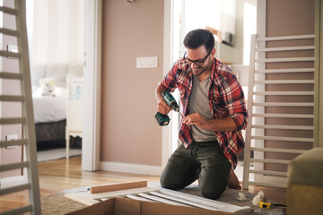 Assembling the crib for new family member