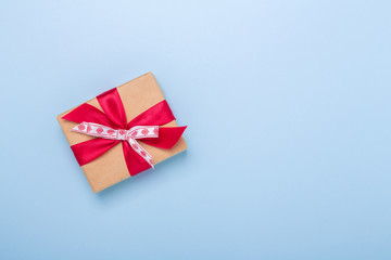 Christmas gift box on blue background. Top view with copy space - Image