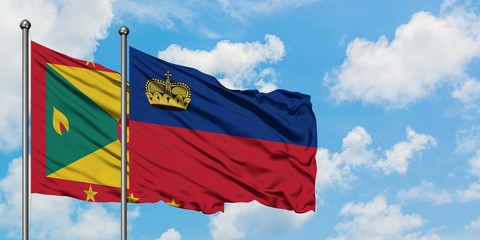 Grenada and Liechtenstein flag waving in the wind against white cloudy blue sky together. Diplomacy concept, international relations.