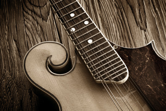 vintage bluegrass mandolin on aged wood