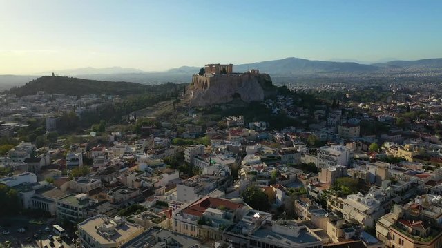 Aerial drone video of iconic Acropolis hill featuring Masterpiece of Ancient world - the Parthenon, Athens historic centre, Attica, Greece