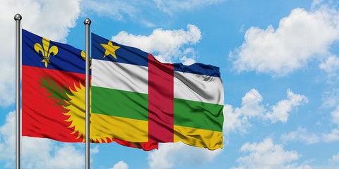 Guadeloupe and Central African Republic flag waving in the wind against white cloudy blue sky together. Diplomacy concept, international relations.