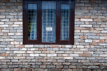 Modern window with skyscraper view in brick wall