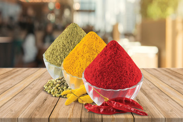 Turmeric, Chilly, Coriander Powder and Coriander Seeds, Dry Chilly, Turmeric Root, wooden...