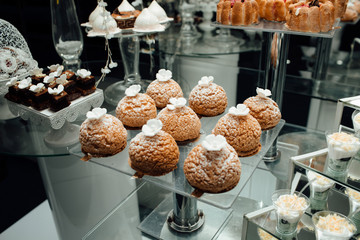 Delicious candy bar for special wedding. Delicious candy bar.  Different delicious desserts and cakes on the buffet table.