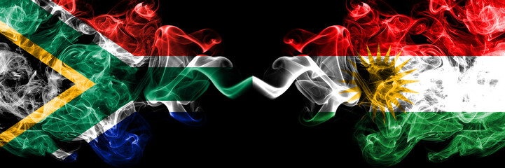South Africa vs Kurdistan, Kurdish smoky mystic flags placed side by side. Thick colored silky abstract smoke flags concept