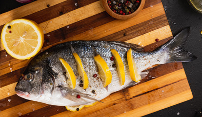 girl cooks dorado fish