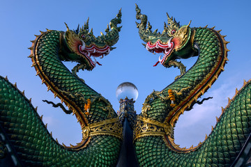 Fototapeta na wymiar Beautiful dragon on the rooftop of Thailand landmark.