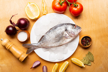 girl cooks dorado fish