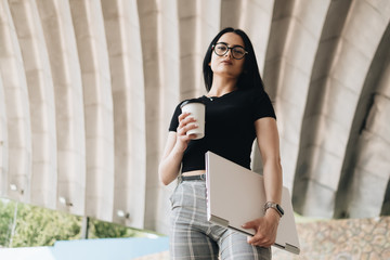 Portrait of Cute Brunette Girl in Black T-shirt with Laptop, Freelance Concept