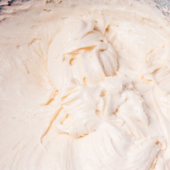 Culinary background - kneading dough for baking close-up, beige tint