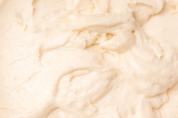 Culinary background - kneading dough for baking close-up, beige tint
