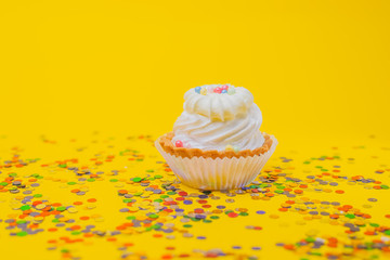 cupcake with icing and sprinkles