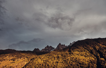 Fototapeta premium Gray gloomy sky on the mountains of the Mont Blanc massif in the Alps, Chamonix, France.
