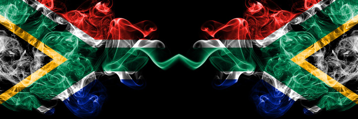 South Africa vs South Africa, African smoky mystic flags placed side by side. Thick colored silky abstract smoke flags concept