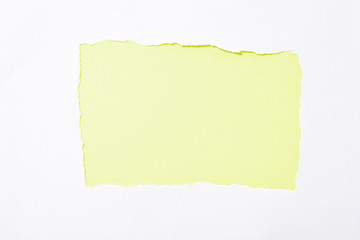 lime green colorful background in white torn paper hole