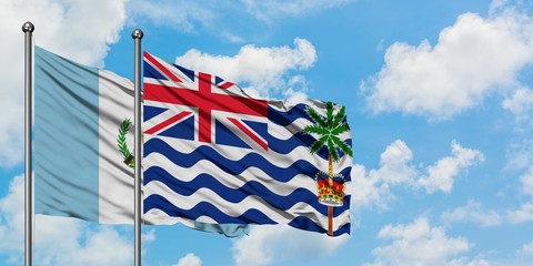 Guatemala and British Indian Ocean Territory flag waving in the wind against white cloudy blue sky together. Diplomacy concept, international relations.