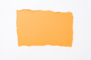 orange colorful background in white torn paper hole