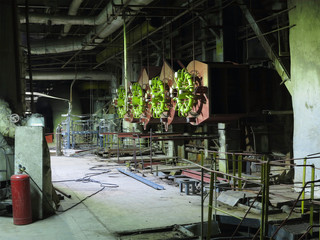 Giant gas-burners, glitter tubes, equipment, cables and piping inside a modern industrial power plant
