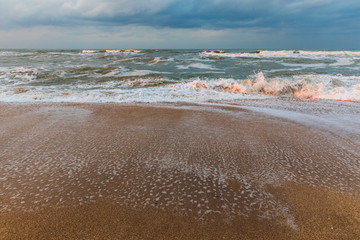 Stormy sunset on the sea coast