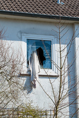 window with cracked glass after stone throw vandalism