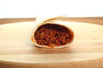 Beef tortilla with chili sauce. Enchilada.
