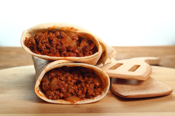 Beef tortilla with chili sauce. Enchilada.