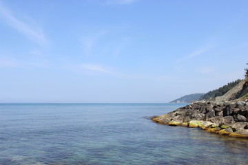 Blue clear sea, cliff and blue sky landscape