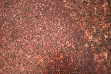 Background.Texture. Natural polished stone . Red granite.