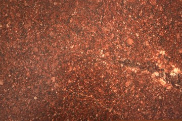 Background.Texture. Natural polished stone . Red granite.